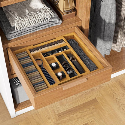 Bamboo drawer organizer holding watches, ties and belts in a dresser drawer
