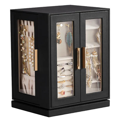 The jewelry cabinet from the front corner: two clear front doors and a clear side door, filled with rings, earrings and necklaces